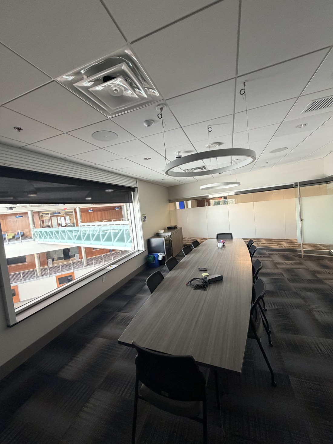 A conference room overlooking a building atrium at an HM Solutions account